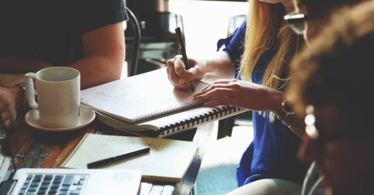 Community Projects - Person Writing on the Notebook