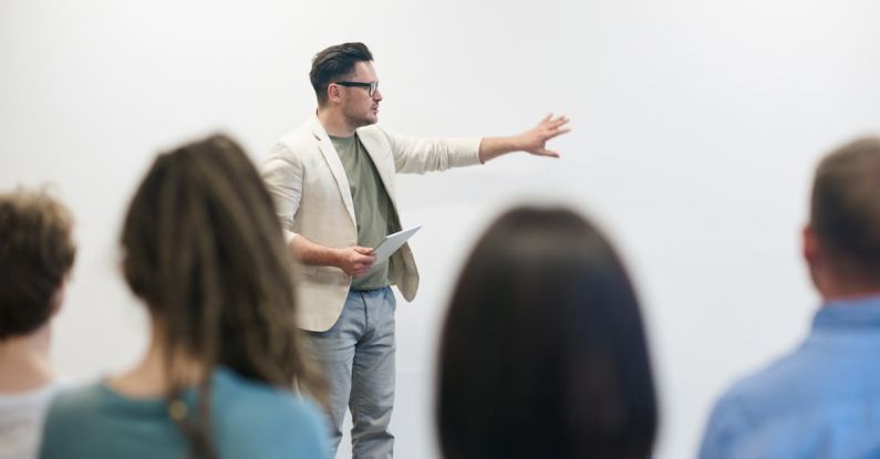 Presentation - Man in Beige Blazer Holding Tablet Computer